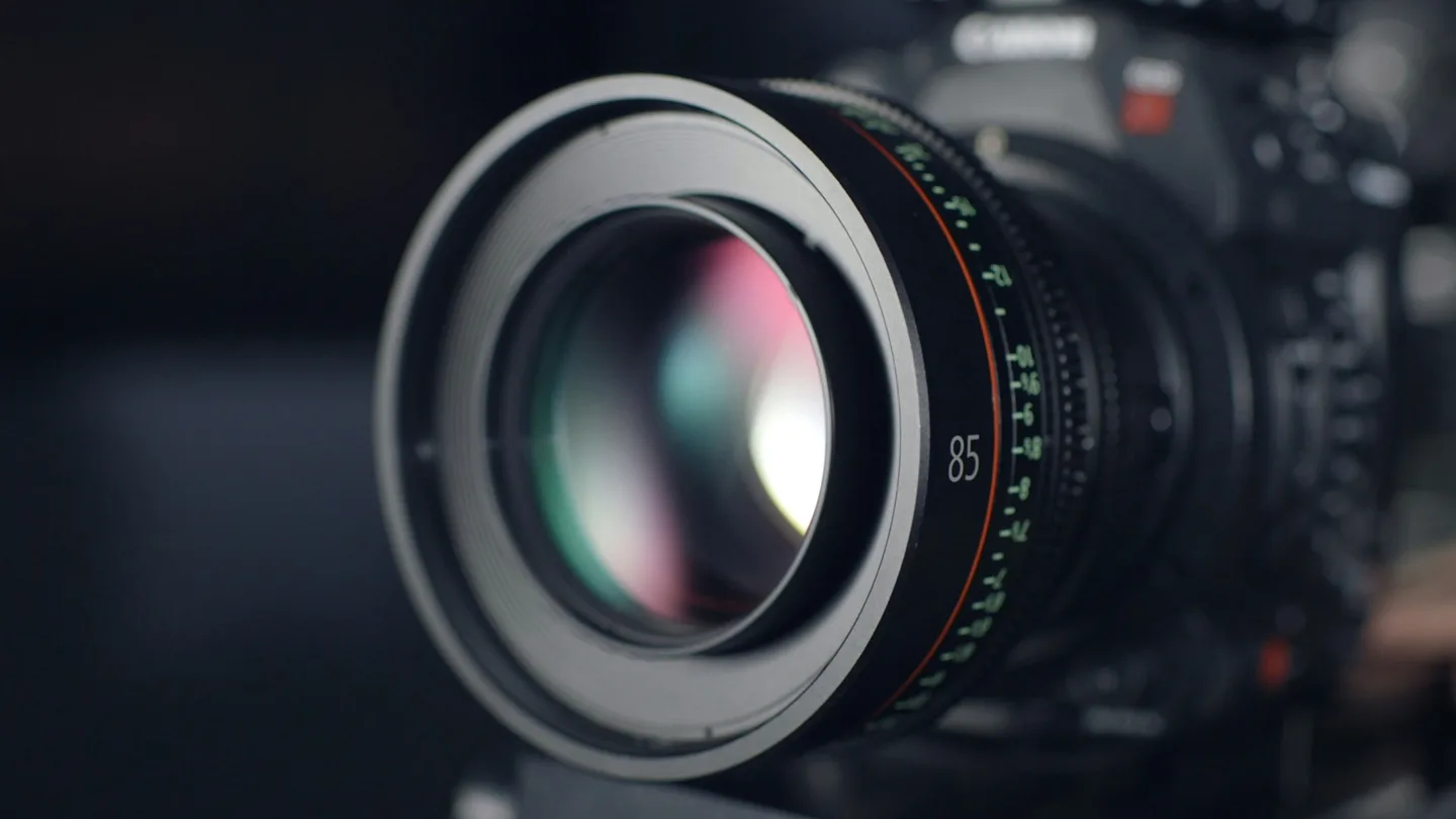 Camera lens in professional video production setup — visual atmosphere